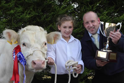 Emily Martin from Newtownards with her show champion included is Colin Harbinson from the Meat Joint Antrim who sponsored the championship 